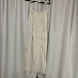 Spaghetti strap tulle dress with glittery gold dot details that catch the light